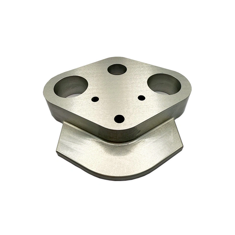 Precision machined metal plate with multiple circular holes and a curved stepped base